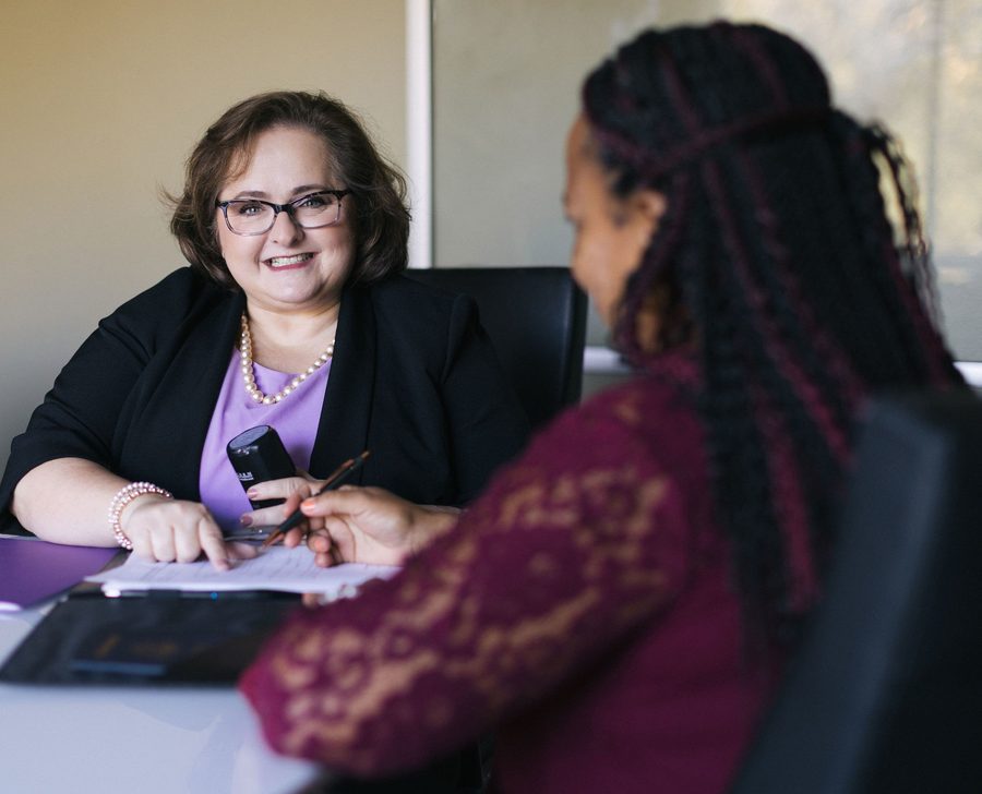 Suzanna Roberson of Swan Signature Notary with a client